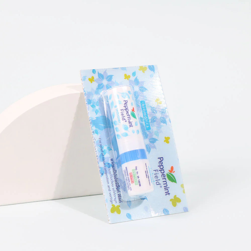 Person using Peppermint Field inhaler demonstrating proper nasal inhalation technique for congestion relief and aromatherapy benefits