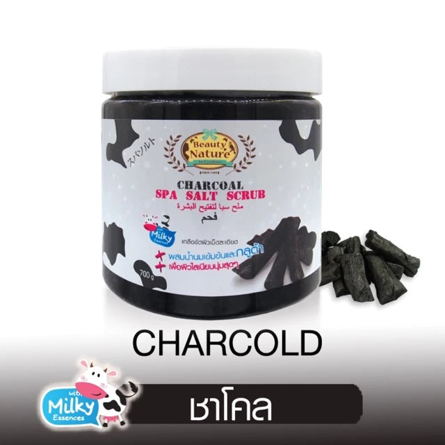 Jar of charcoal spa salt scrub with packaging details on a white background
