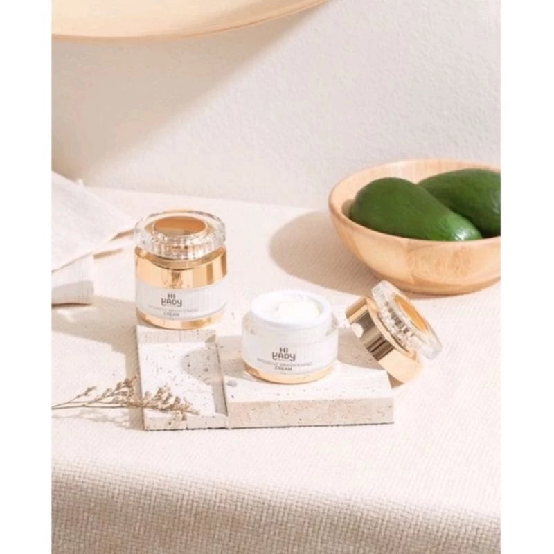 Woman applying Hi Yady intensive cream with upward massage technique demonstrating proper brightening skincare application method