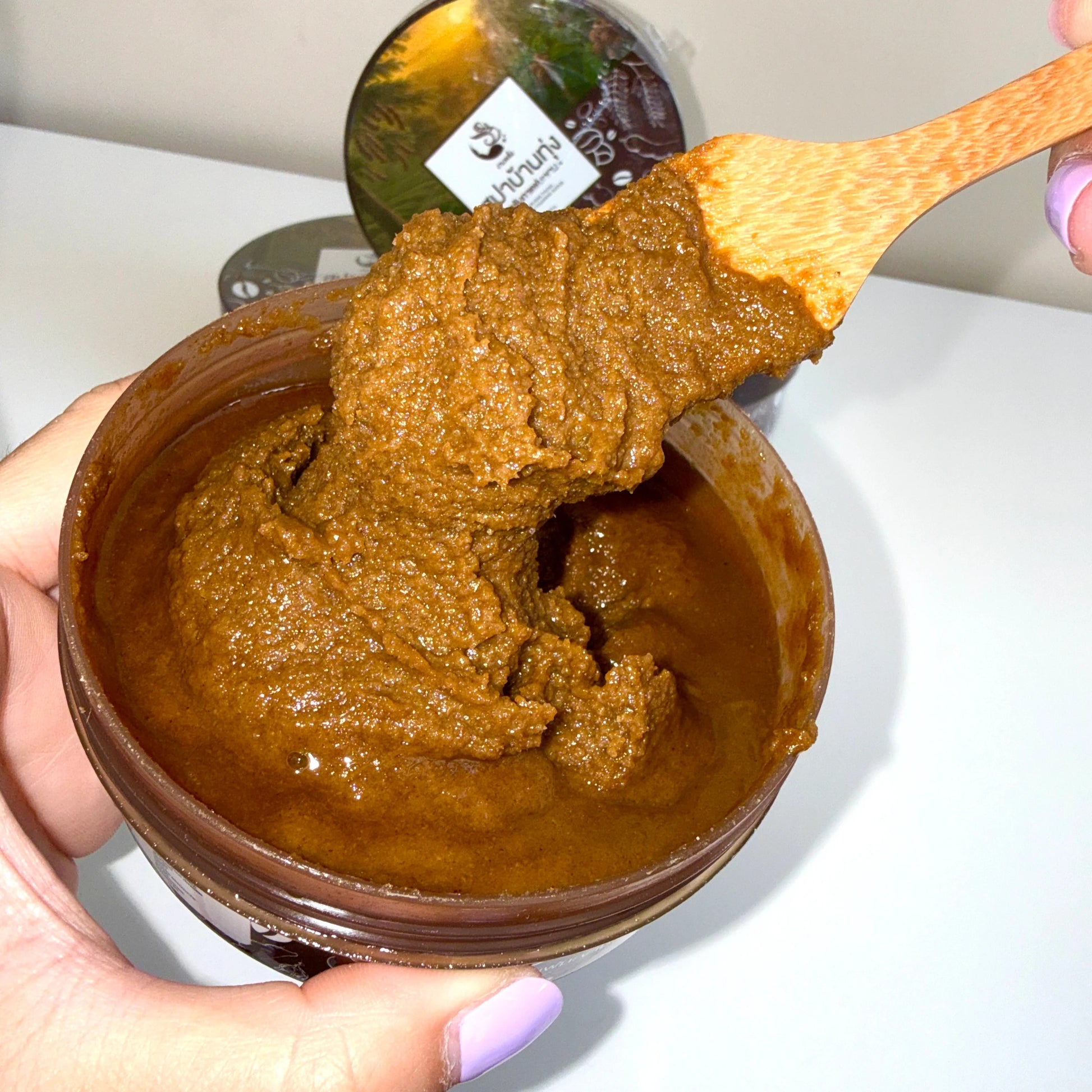 Woman using Spa Ban Thung Coffee Tamarind Scrub for smooth revitalized radiant body skin before after