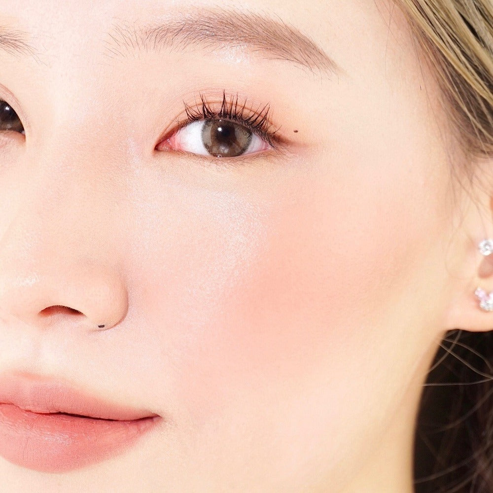 Woman applying Sasi Sasi Kiss Blush Stick for rosy natural long-lasting glow before after