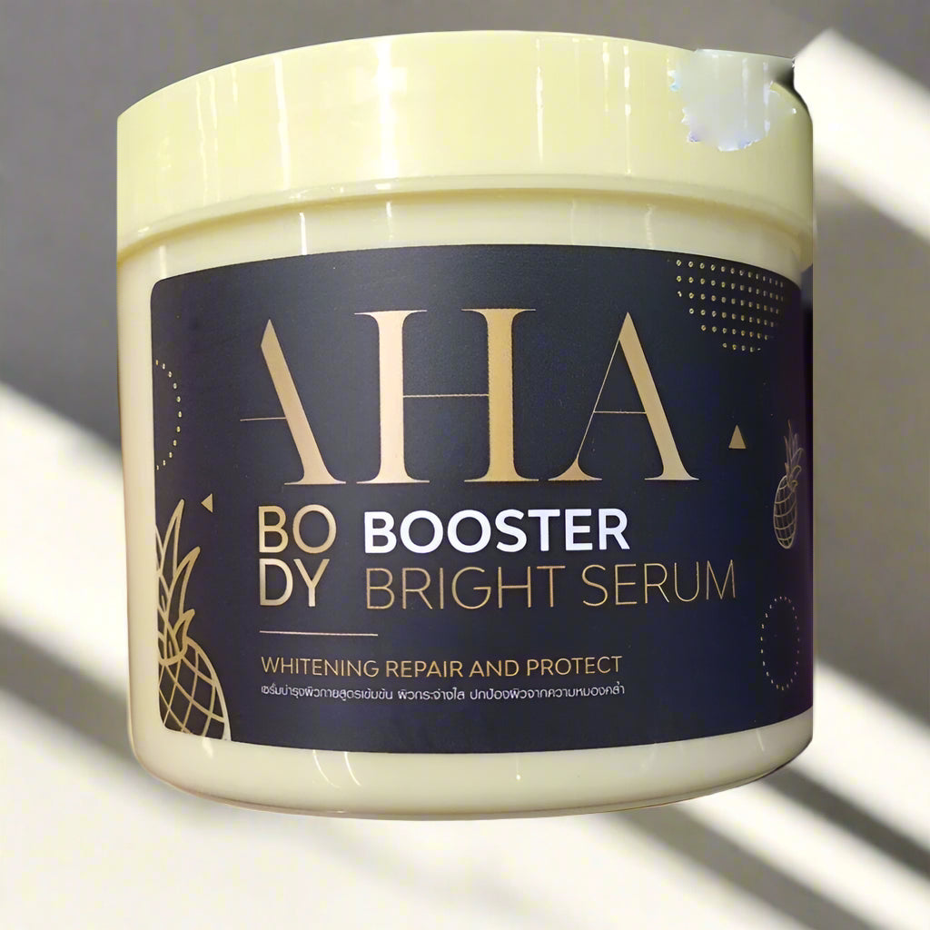 Jar of AHA Body Booster Bright Serum with a dark label and gold text.