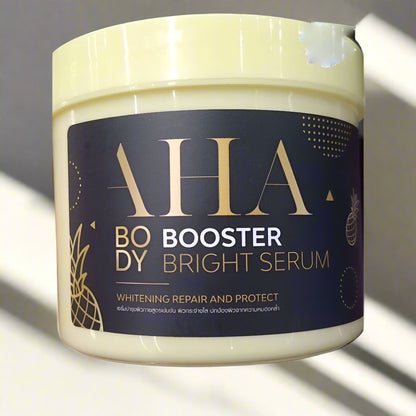 Jar of AHA Body Booster Bright Serum with a dark label and gold text.