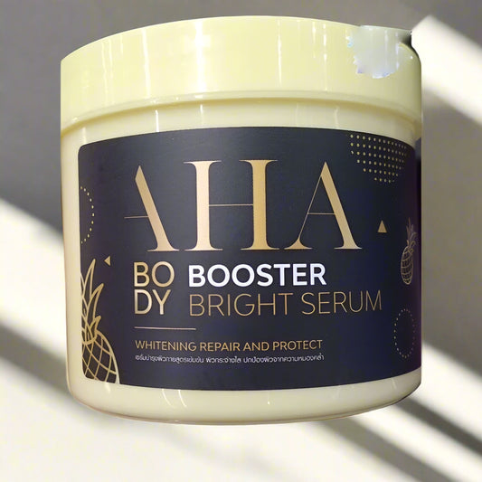 Jar of AHA Body Booster Bright Serum with a dark label and gold text.
