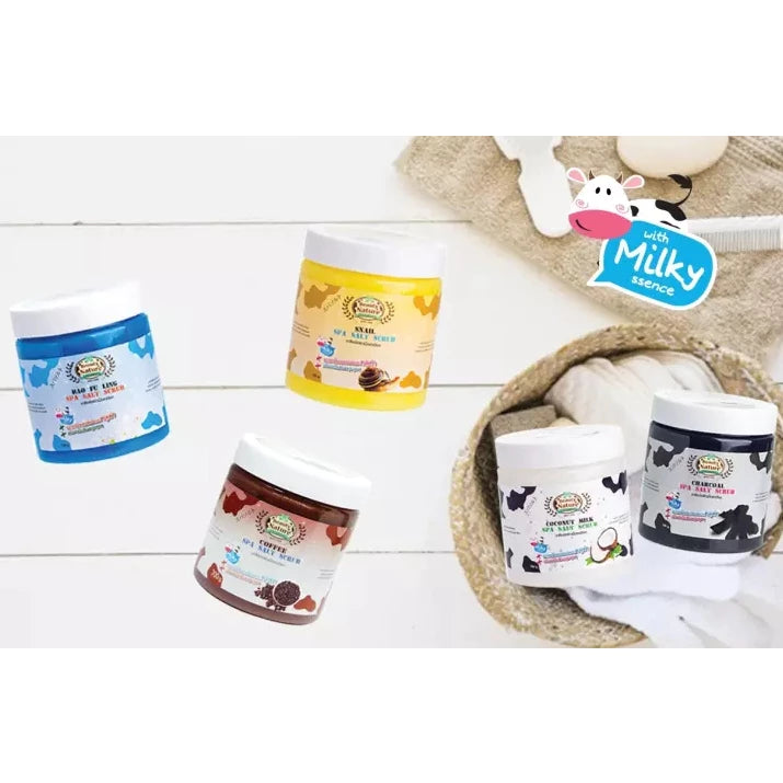 Assorted jars of baby food on a white wooden surface with a 'Milky' brand logo.