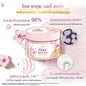 Dove body scrub jar with floral elements on a pink background