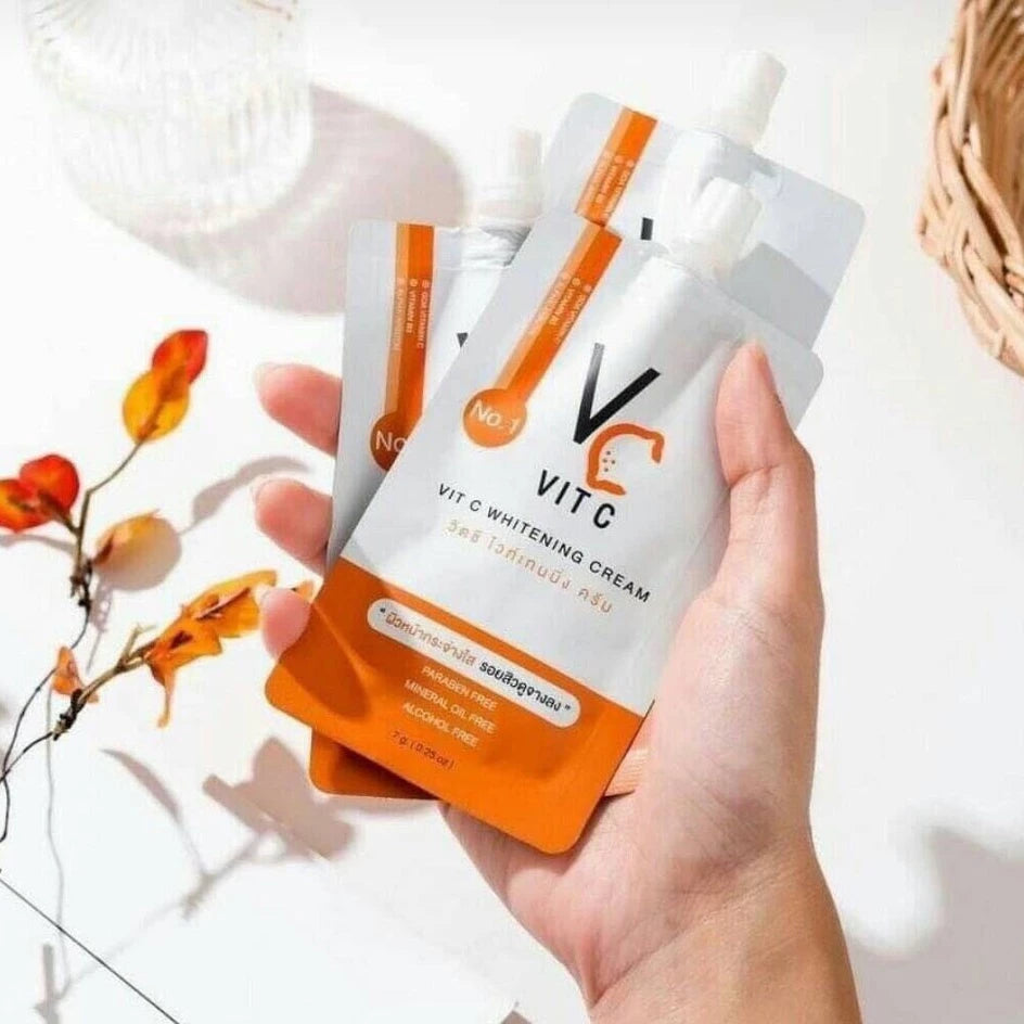 Woman applying Ratcha Vit C Whitening Cream for clear bright radiant glowing skin before after dark spot results