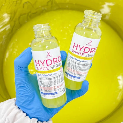 Close up of ZQUEEN Hydro White Dose 100ml label highlighting niacinamide tranexamic acid hydroxyphenoxypropionic acid and glycolic acid brightening body serum formula
